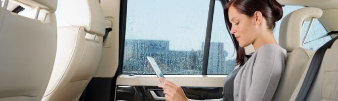a woman sitting behind in the limousine