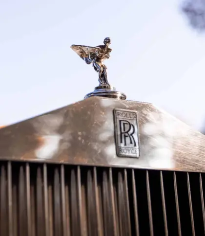 Rolls royce logo in the front of a car